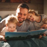 Father reading to kids before bed