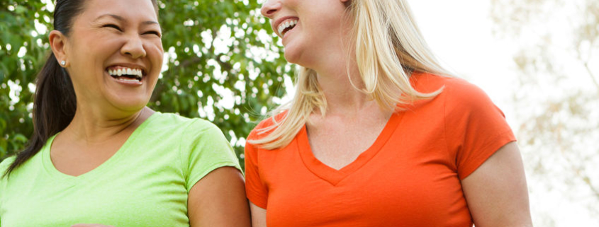 Women walking and laughing