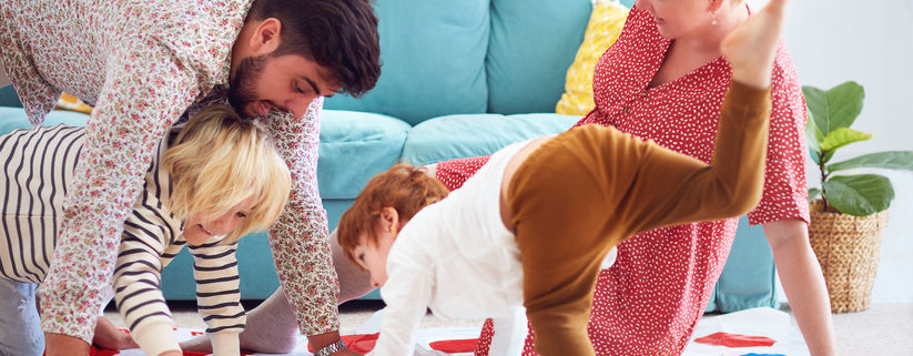 Family playing twister together