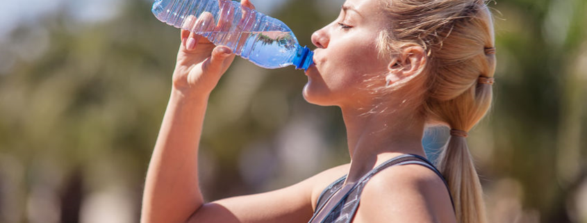 woman drinking water bottle