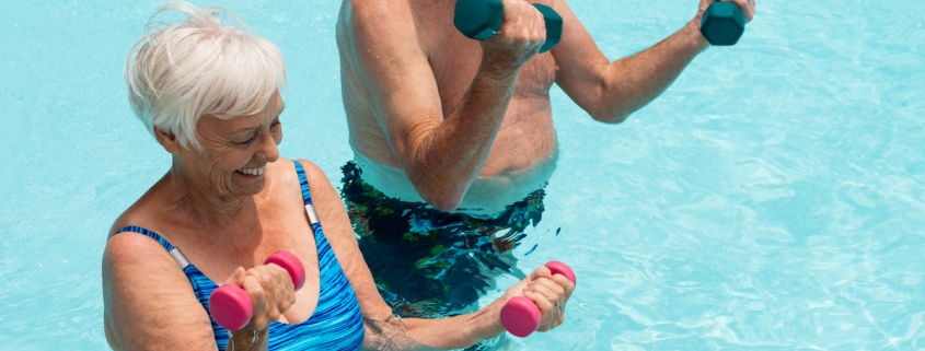 man and woman exercising in the pool