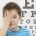 Boy having eye test.