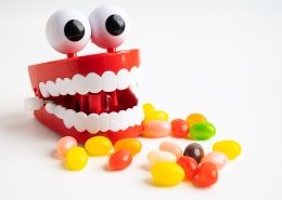 candy alongside a dental mouth with eyes